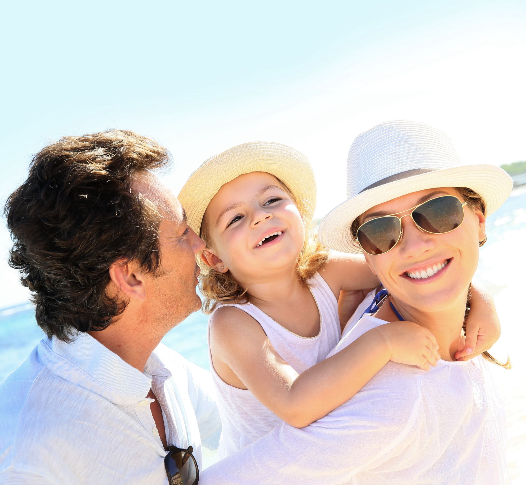 Parents and daughter at the beach