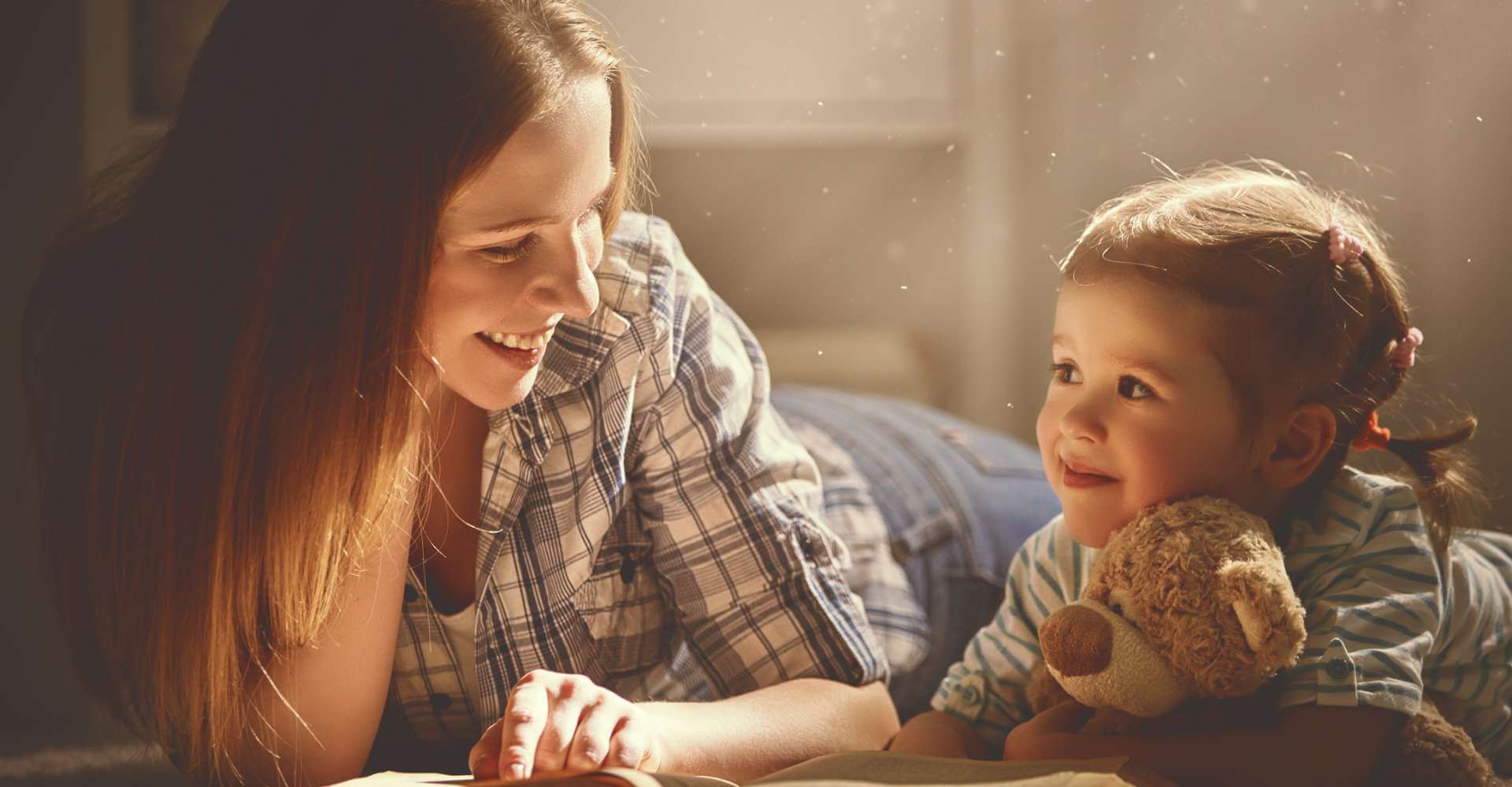 Mother reading to her daughter
