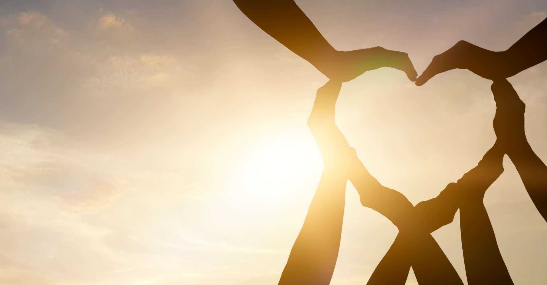 Love heart mad out of multiple peoples hands